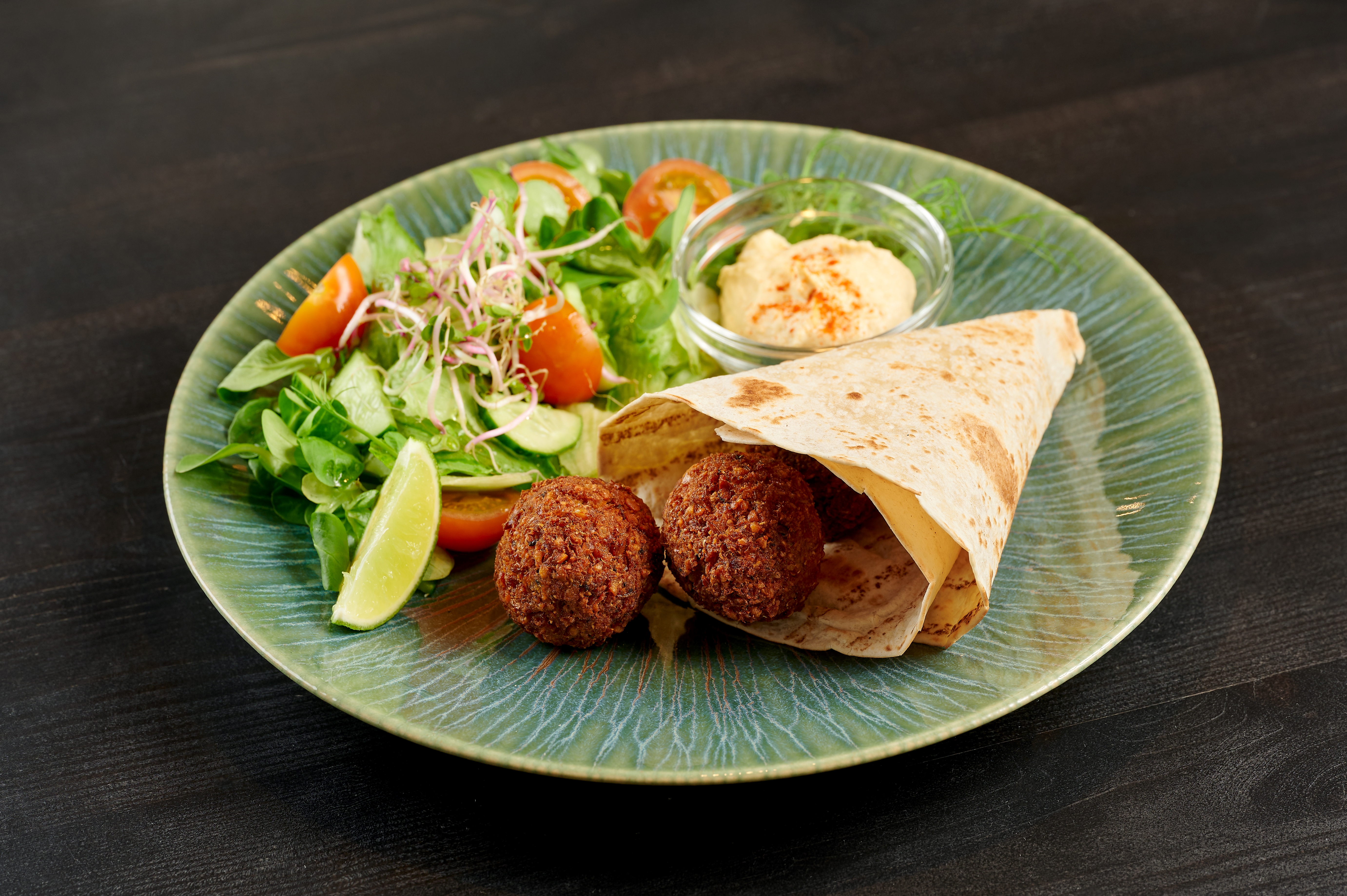 Crispy falafels served with hummus, basmati rice and fresh salad